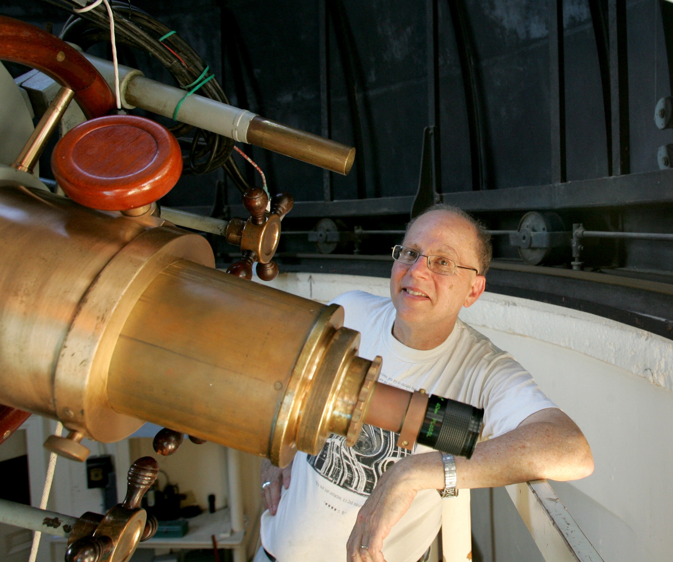 Photo of Joel on the 16-inch Brashear Telescope at Carleton's Goodsell Observatory, June 2012